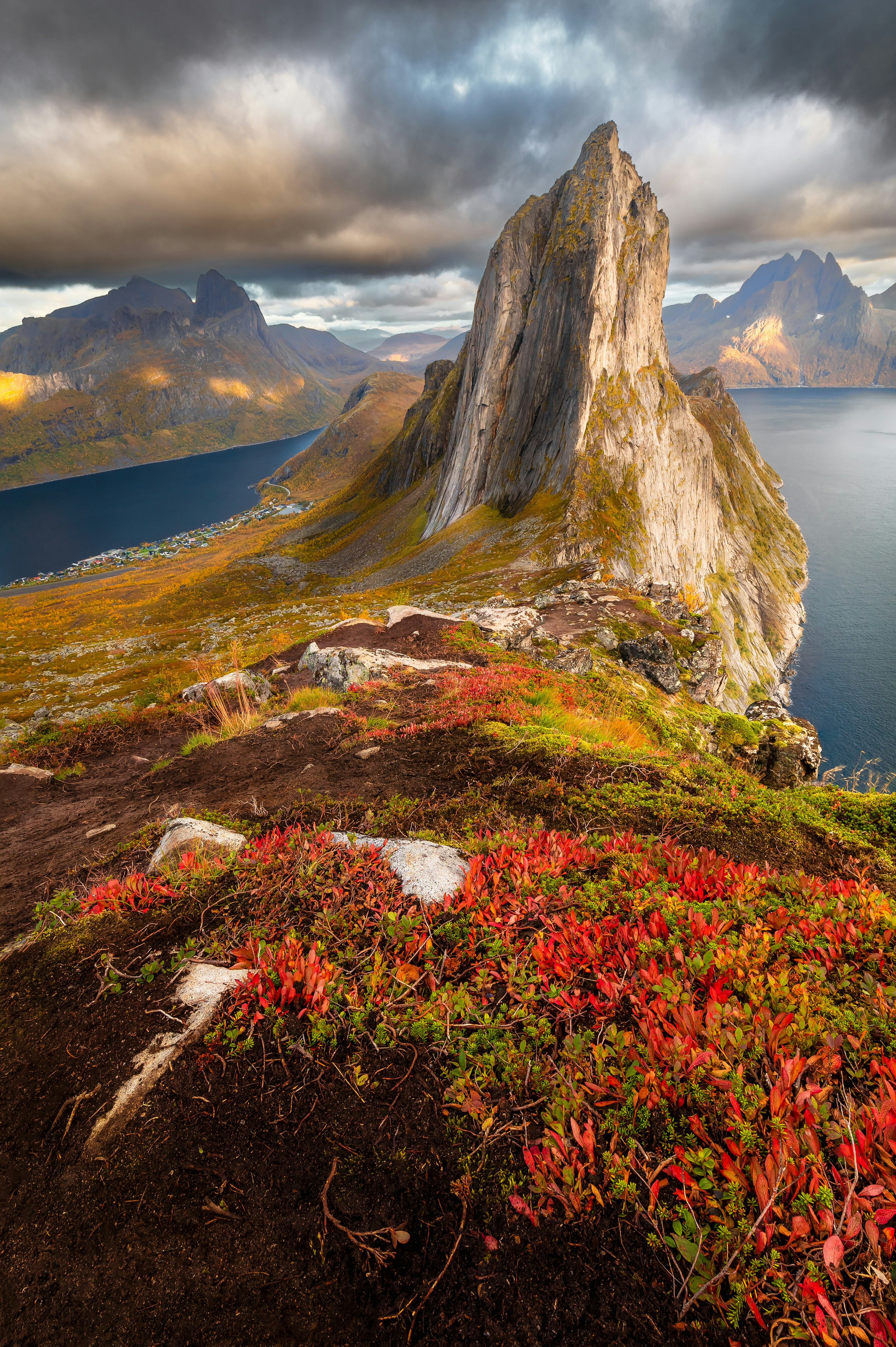Segla mountain on Senja — dramatic rocky peak rising above the fjord in autumn light
